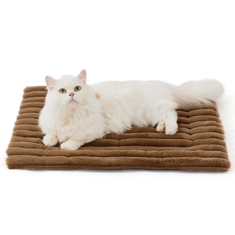 Brown corduroy self-warming cat bed mat with a white cat lying on it